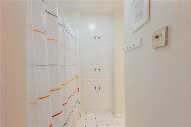a bathroom with a bathtub and shower
