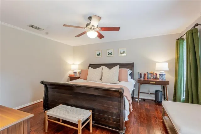 a bed room with a bed and a chandelier