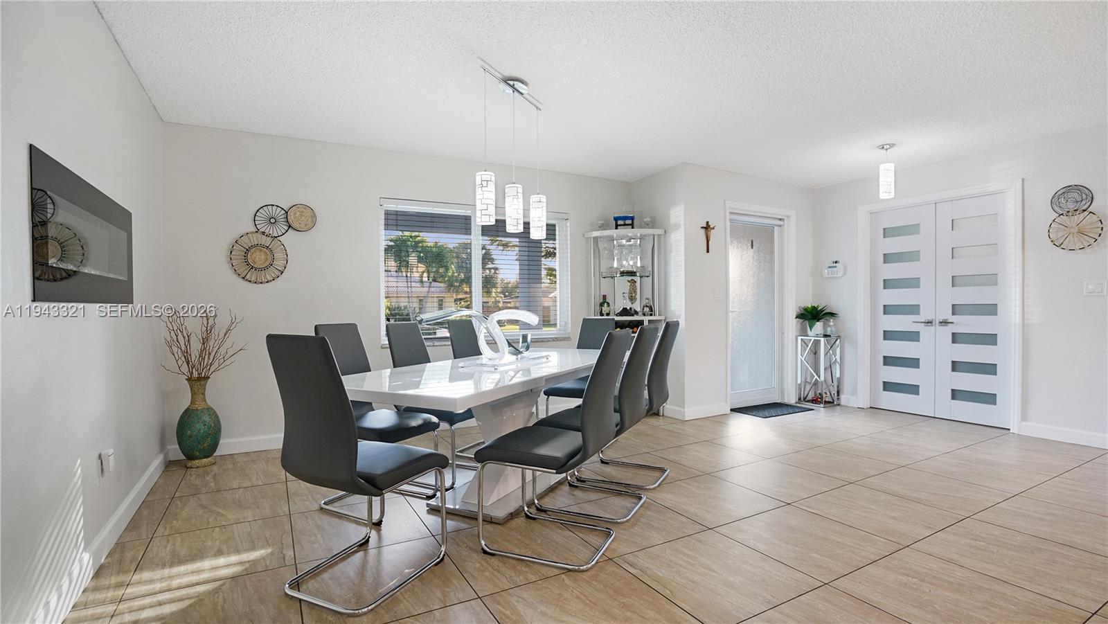 5921 Southwest 17th Street Plantation, FL 33317 - Photo 11 of 53 a view of a livingroom with furniture and lounge chair