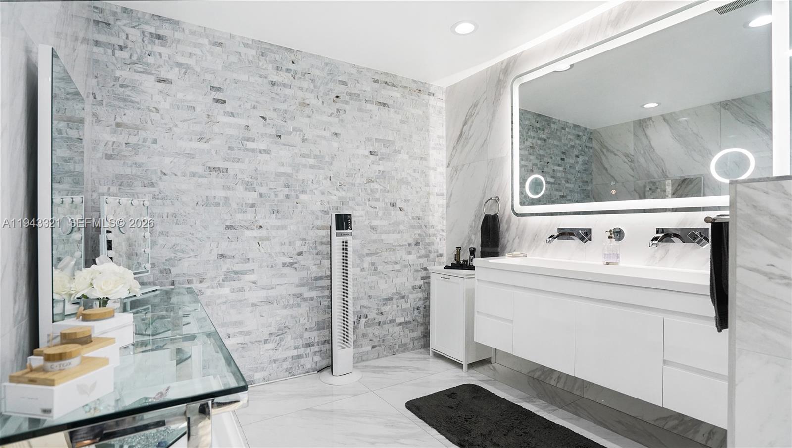 5921 Southwest 17th Street Plantation, FL 33317 - Photo 26 of 53 a bath room with a sink and a mirror