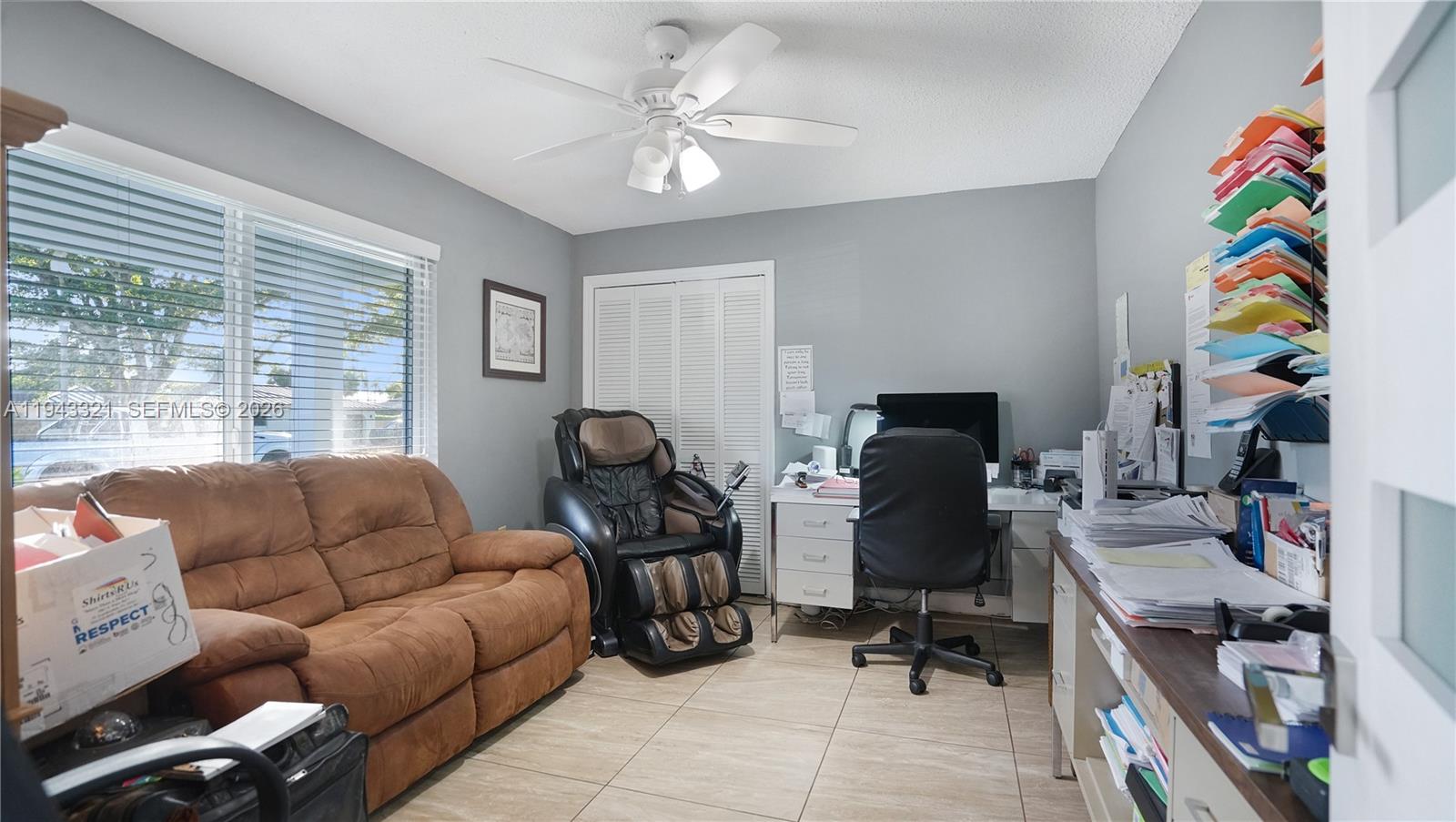 5921 Southwest 17th Street Plantation, FL 33317 - Photo 34 of 53 a work room with furniture and wooden floor
