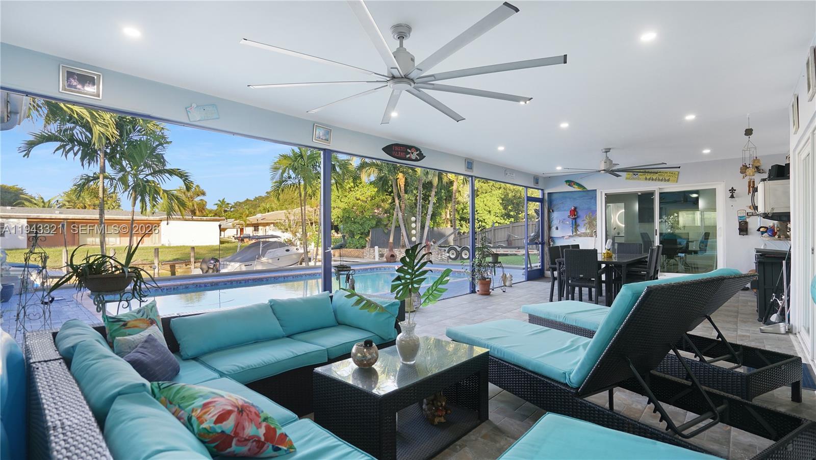 5921 Southwest 17th Street Plantation, FL 33317 - Photo 37 of 53 a living room with furniture and a large window