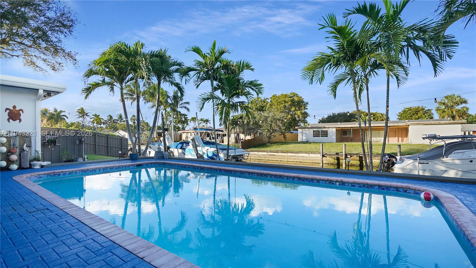 5921 Southwest 17th Street Plantation, FL 33317 - Photo 39 of 53 a view of swimming pool with a table and chairs