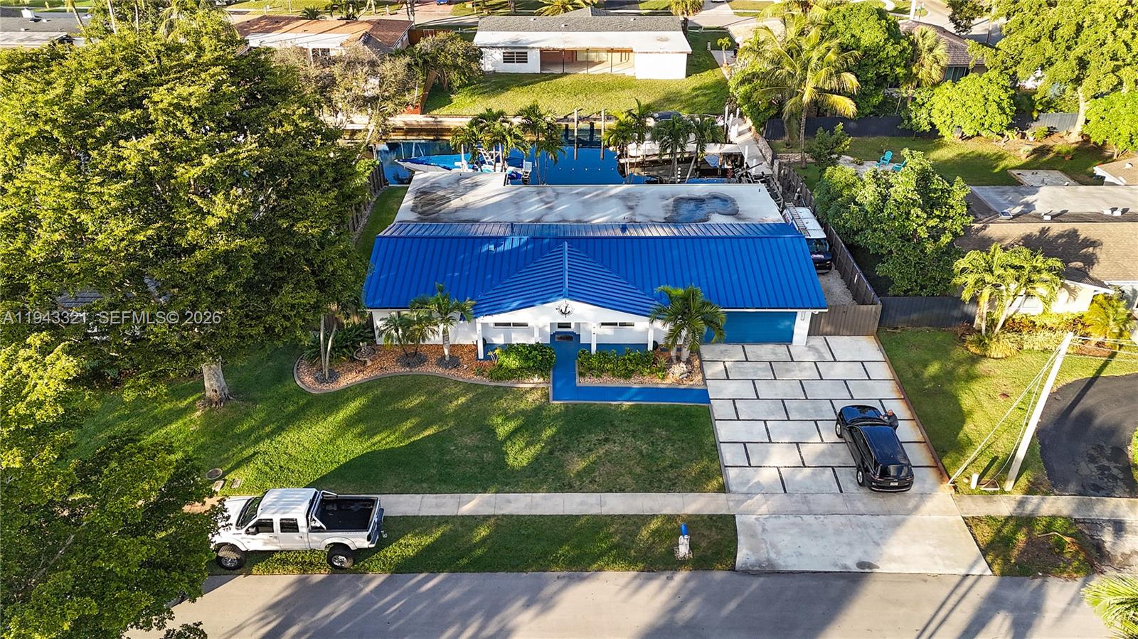 5921 Southwest 17th Street Plantation, FL 33317 - Photo 4 of 53 an aerial view of a house with a garden