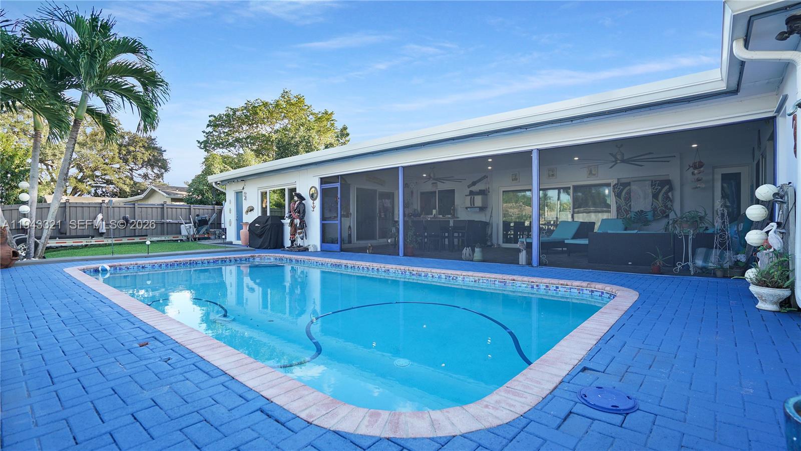 5921 Southwest 17th Street Plantation, FL 33317 - Photo 41 of 53 a view of outdoor space yard swimming pool and porch