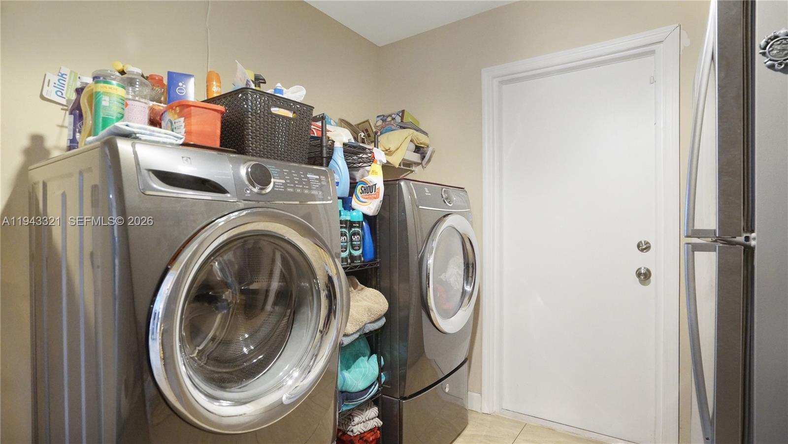 5921 Southwest 17th Street Plantation, FL 33317 - Photo 46 of 53 a utility room with dryer and washer