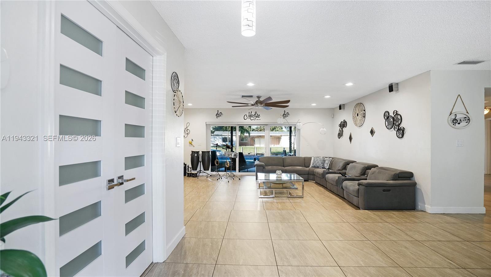 5921 Southwest 17th Street Plantation, FL 33317 - Photo 7 of 53 a living room with furniture and white walls