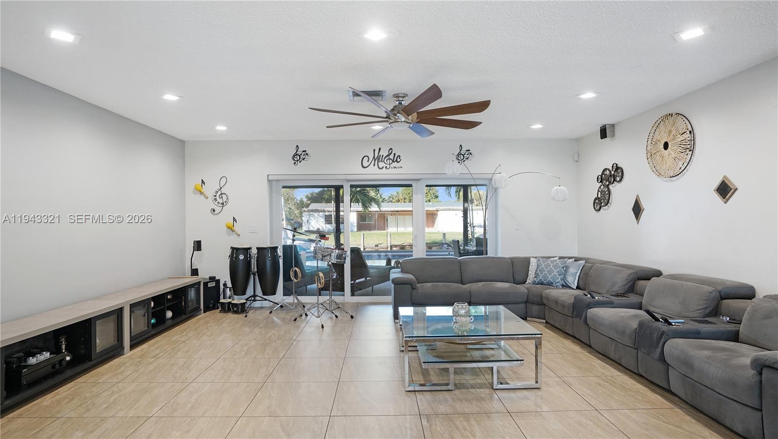 5921 Southwest 17th Street Plantation, FL 33317 - Photo 8 of 53 a living room with furniture and a large window