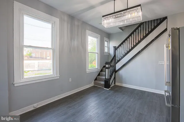 a view of staircase with wooden floor and staircase