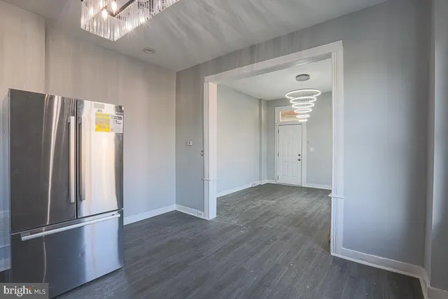 a kitchen with a stove a sink and a microwave