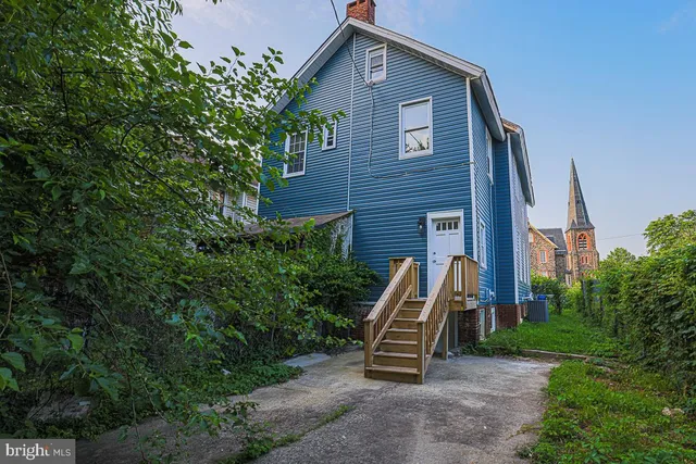 a car parked in front of a house