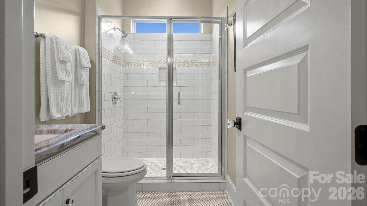 4854 Looking Glass Trail Denver, NC 28037 - Photo 44 of 48 a bathroom with a granite countertop sink toilet and shower