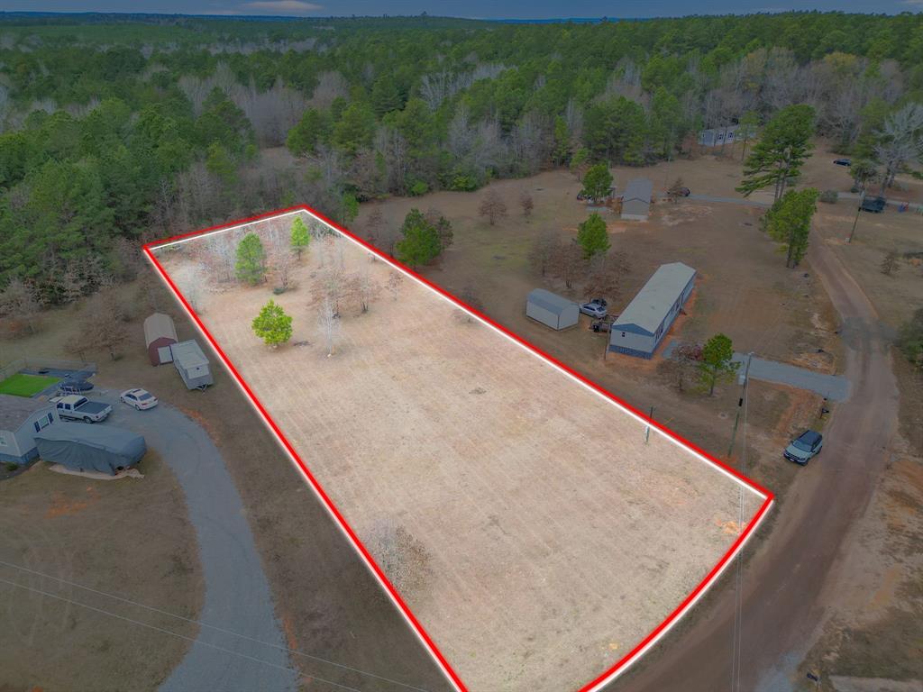 651 Law Harleton, TX 75651 - Photo 1 of 1 Aerial view of property's location featuring a heavily wooded area and property boundaries highlighted