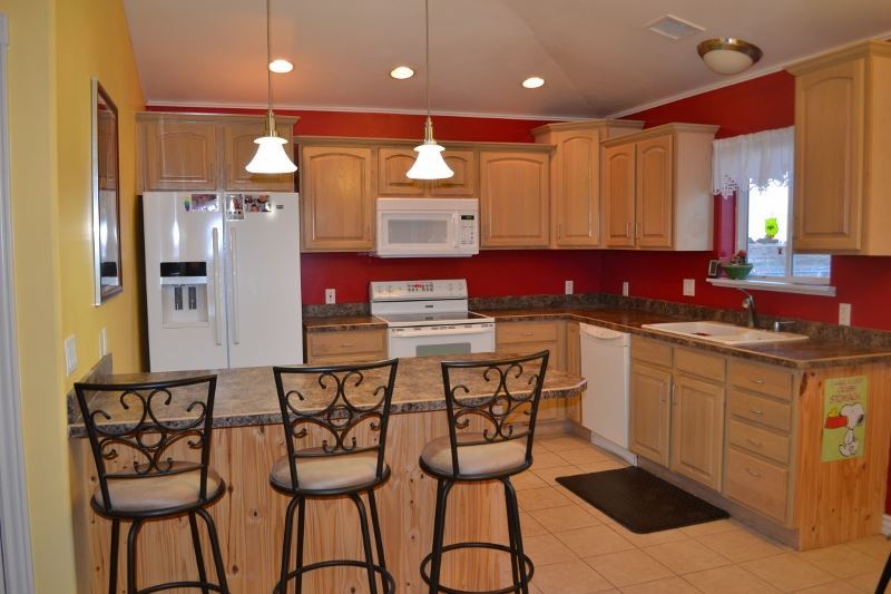 1052 West 8th S Street Snowflake, AZ 85937 - Photo 11 of 36 a kitchen with stainless steel appliances kitchen island granite countertop a sink and cabinets