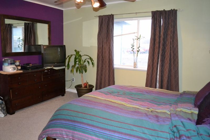 1052 West 8th S Street Snowflake, AZ 85937 - Photo 24 of 36 a bedroom with a bed dresser and a window
