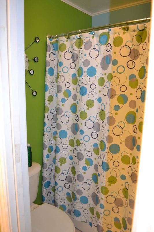 1052 West 8th S Street Snowflake, AZ 85937 - Photo 28 of 36 a bathroom with a bathtub and shower curtain