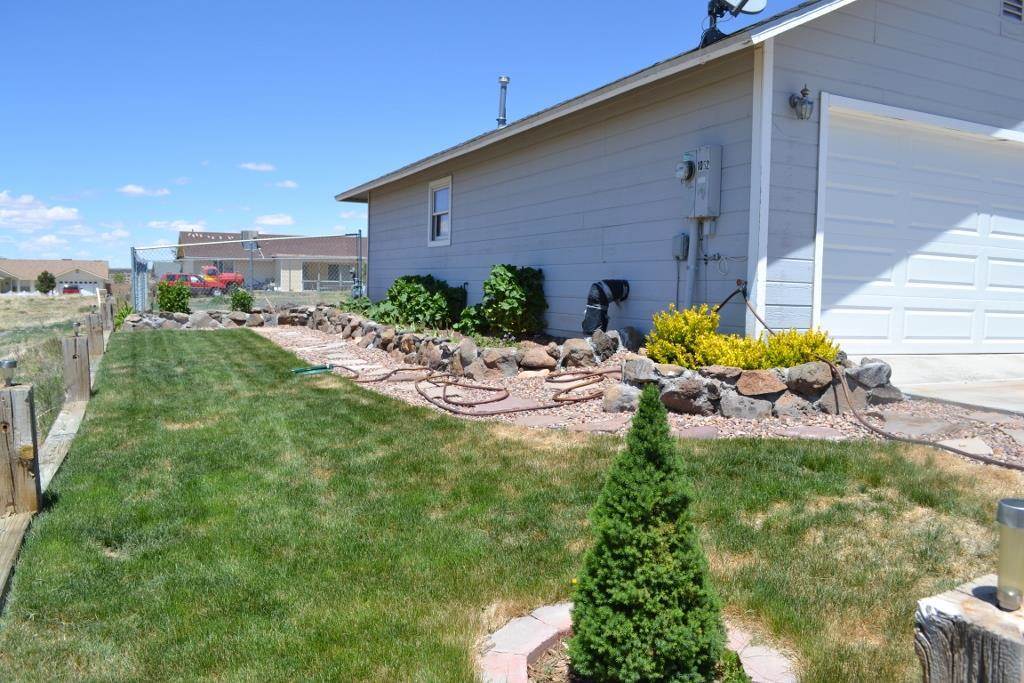 1052 West 8th S Street Snowflake, AZ 85937 - Photo 5 of 36 a view of a backyard with plants and a patio