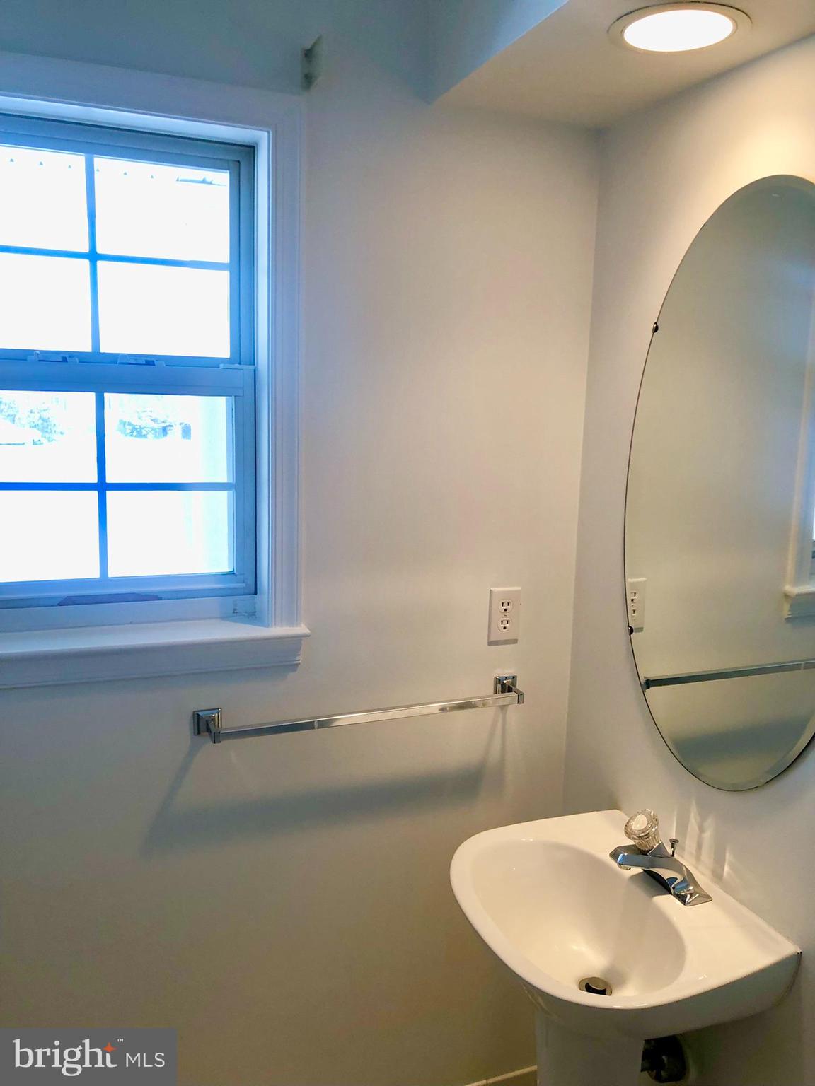 359 Freshfield Lane Arnold, MD 21012 - Photo 18 of 22 a bathroom with a sink and a mirror