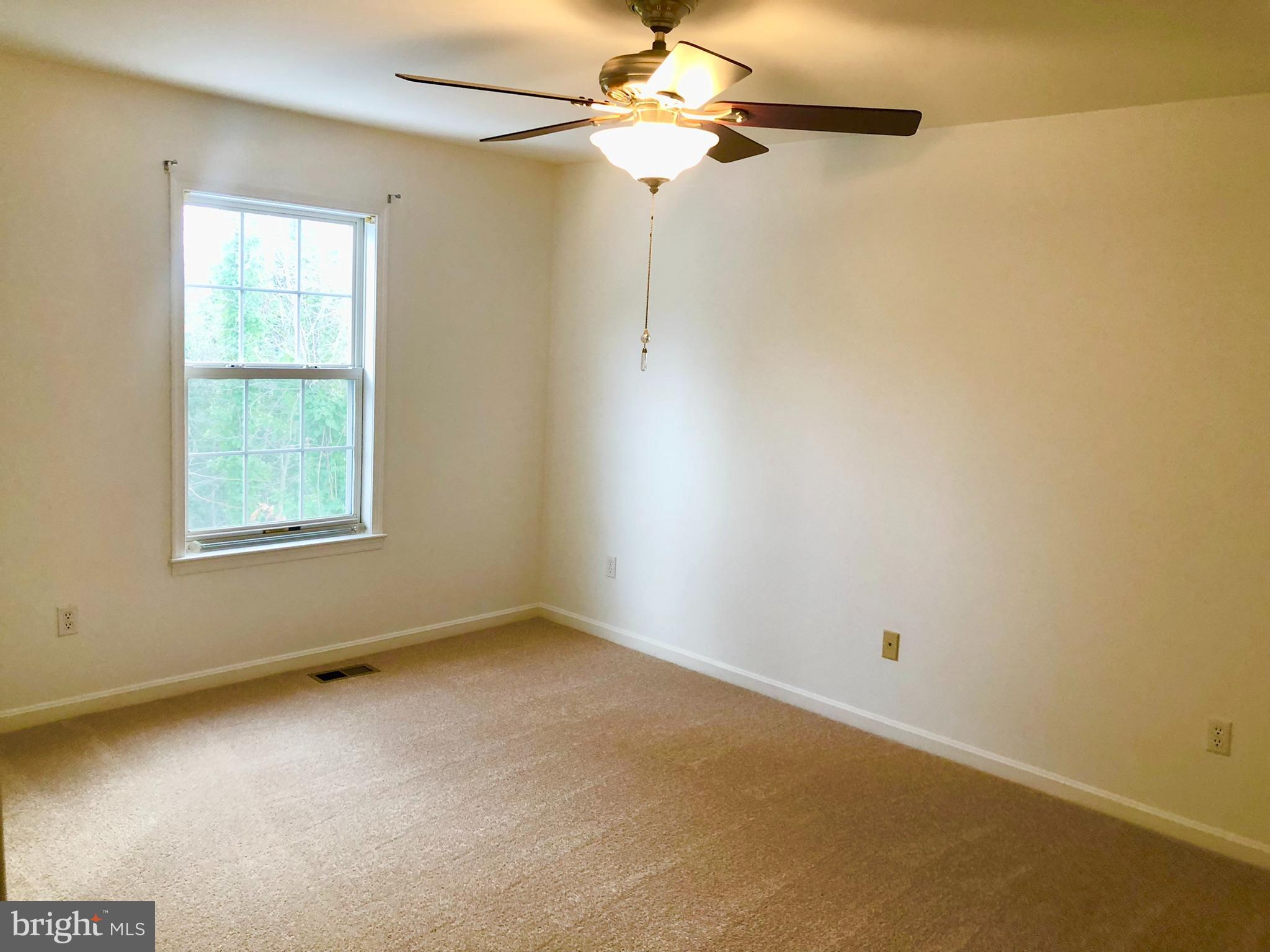 359 Freshfield Lane Arnold, MD 21012 - Photo 9 of 22 an empty room with a window and a fan
