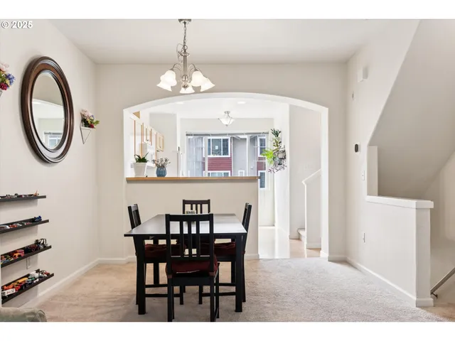 a kitchen with granite countertop a sink cabinets and stainless steel appliances