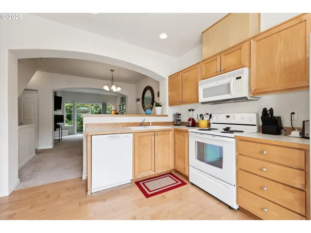 a kitchen with a sink cabinets and window