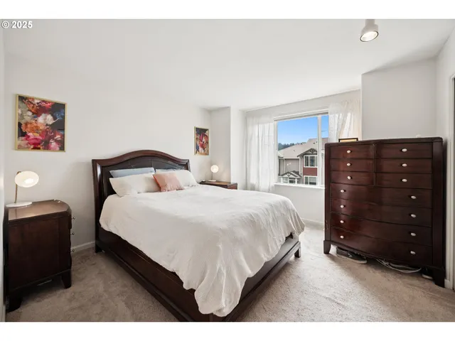 a bedroom with a bed and balcony