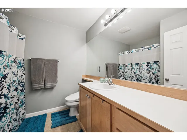 a bedroom with furniture and a large window