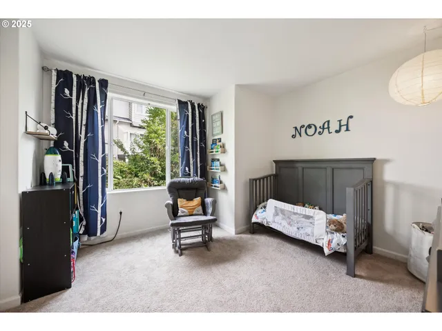a bedroom with furniture and a baby crib