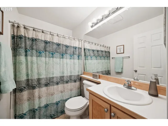 a hallway with a washer and dryer