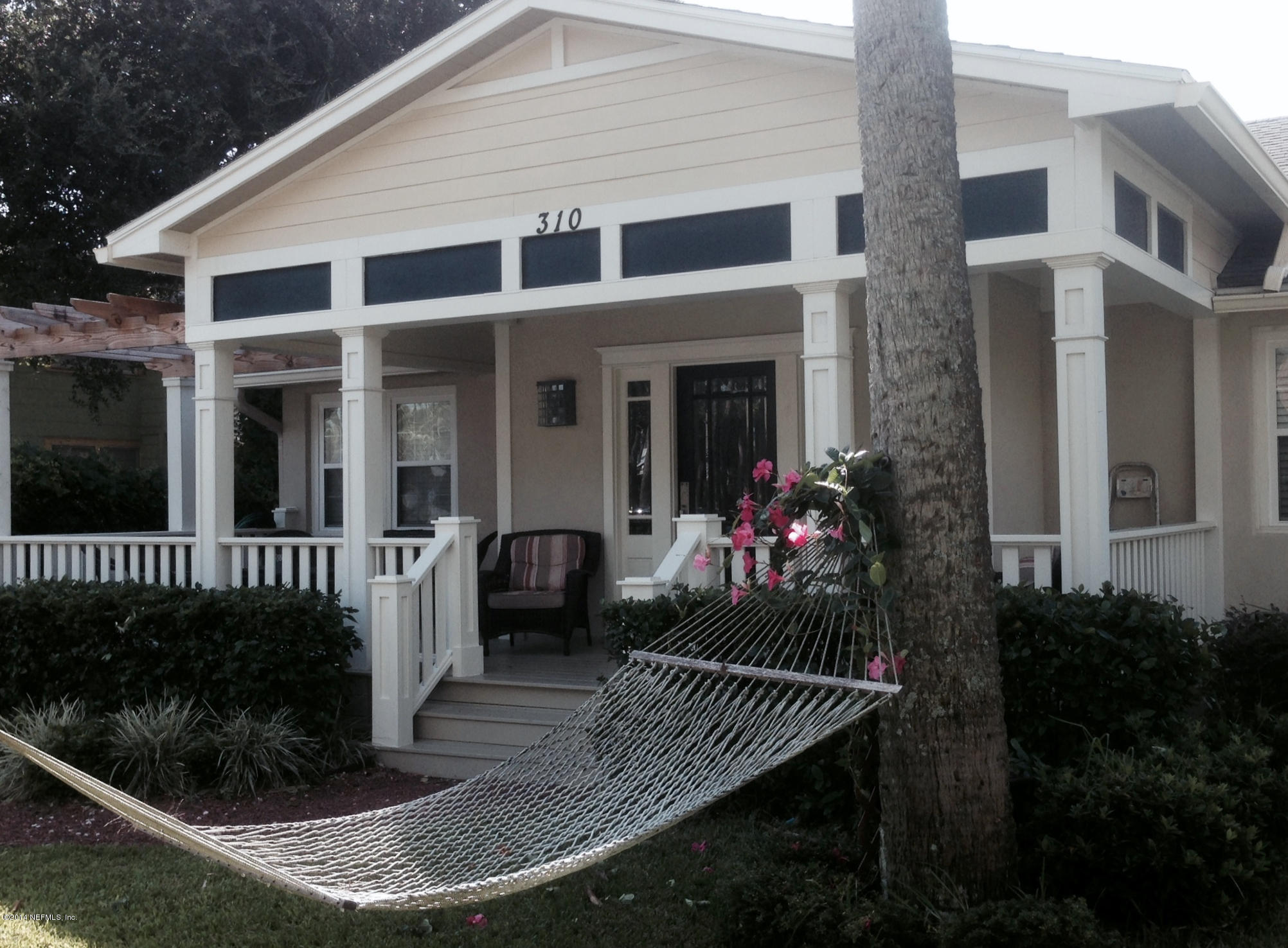 310 7th Street Atlantic Beach, FL 32233 - Photo 2 of 37 a front view of a house having yard