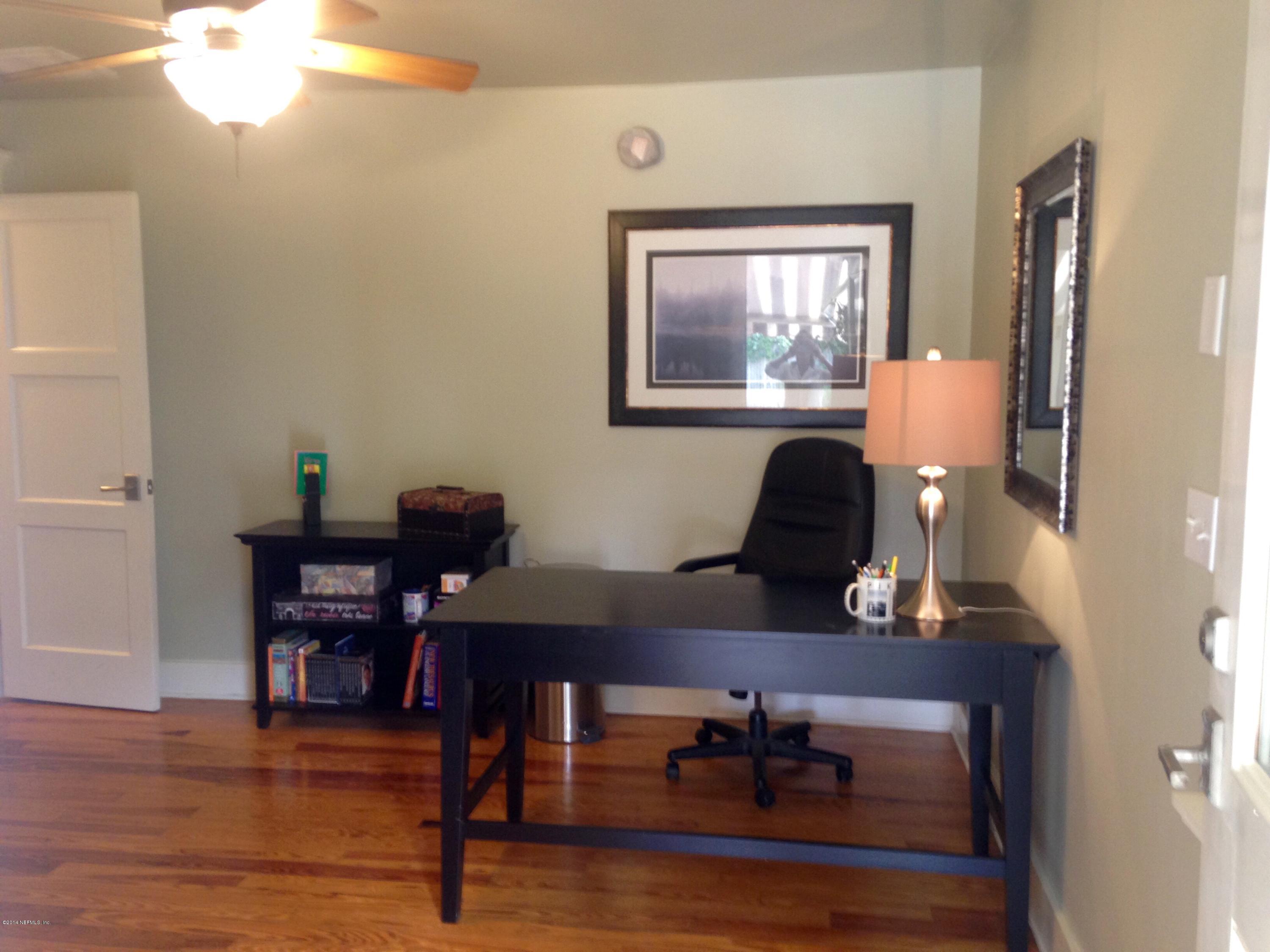310 7th Street Atlantic Beach, FL 32233 - Photo 13 of 37 a view of a workspace with furniture and wooden floor
