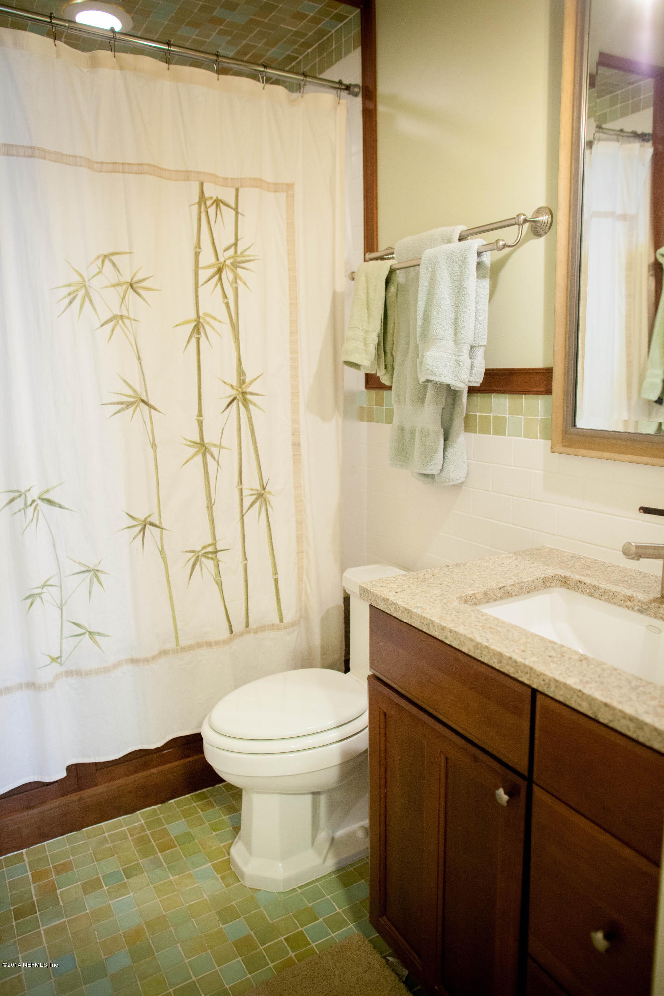 310 7th Street Atlantic Beach, FL 32233 - Photo 14 of 37 a bathroom with a granite countertop sink toilet and shower