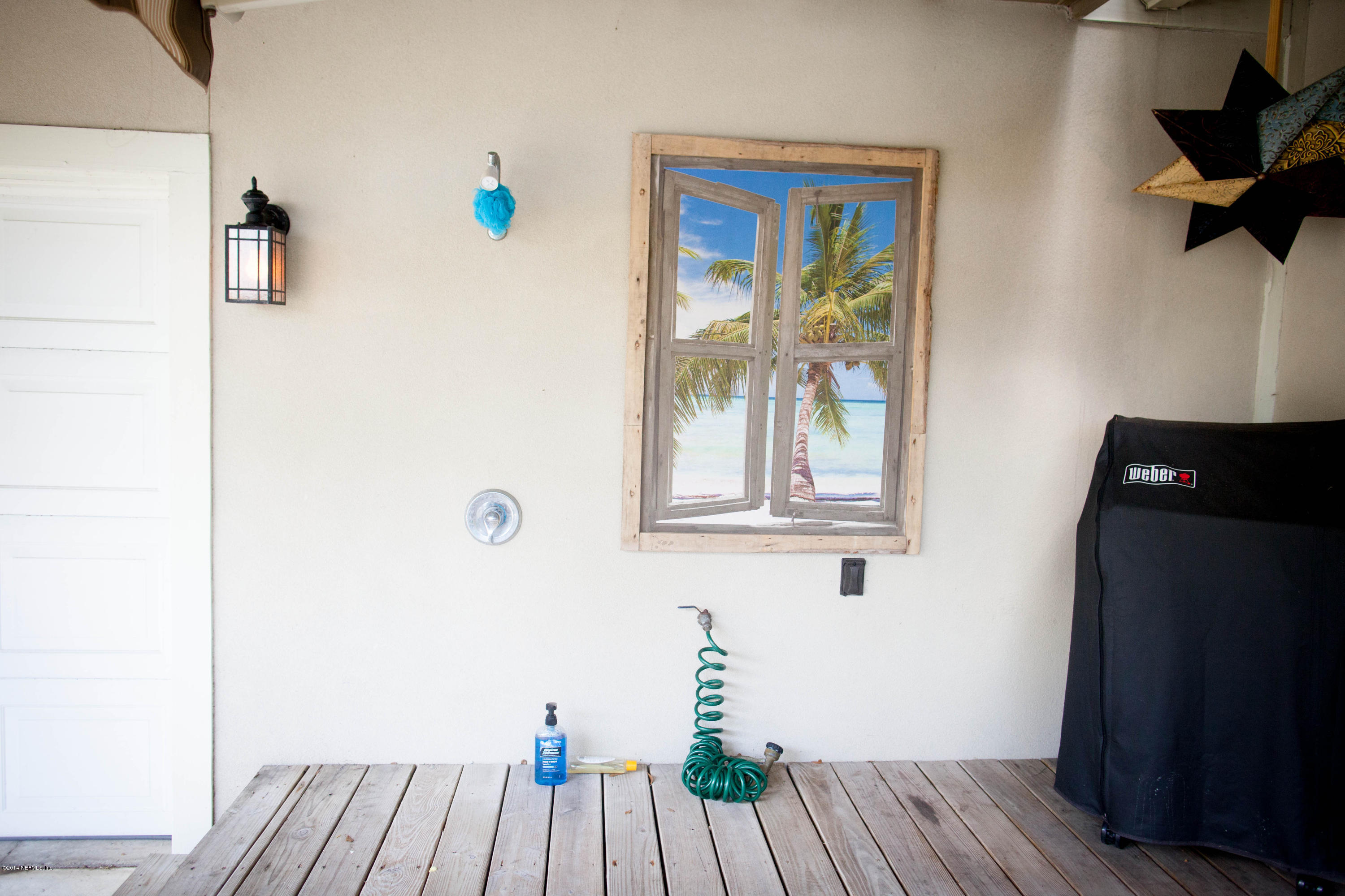 310 7th Street Atlantic Beach, FL 32233 - Photo 20 of 37 a view of a hallway with wooden floor and a bathroom
