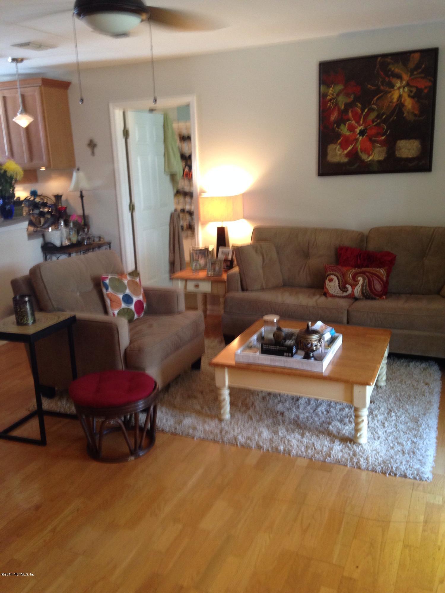 310 7th Street Atlantic Beach, FL 32233 - Photo 23 of 37 a living room with furniture and a couch