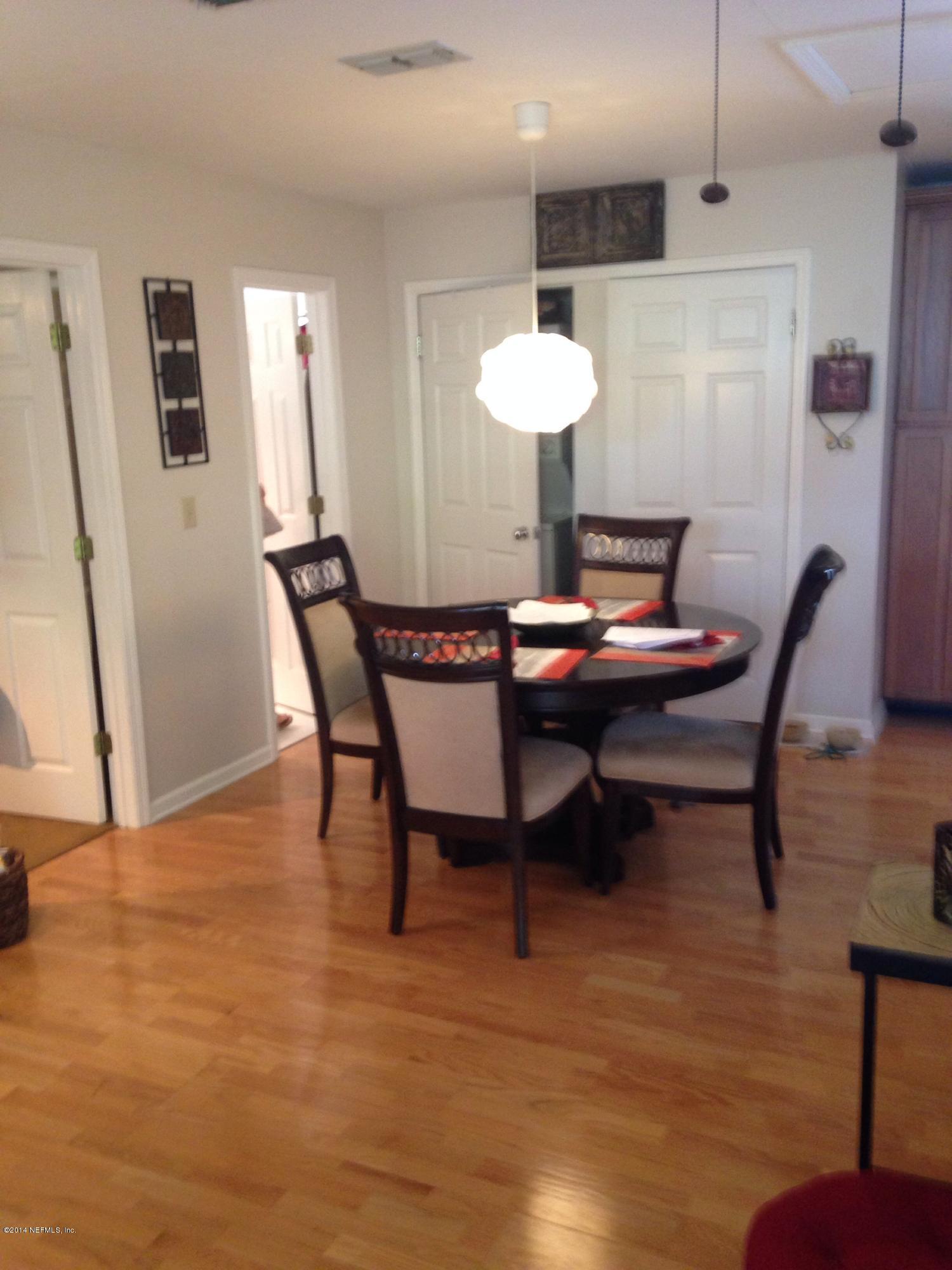310 7th Street Atlantic Beach, FL 32233 - Photo 24 of 37 a dining room with furniture and wooden floor
