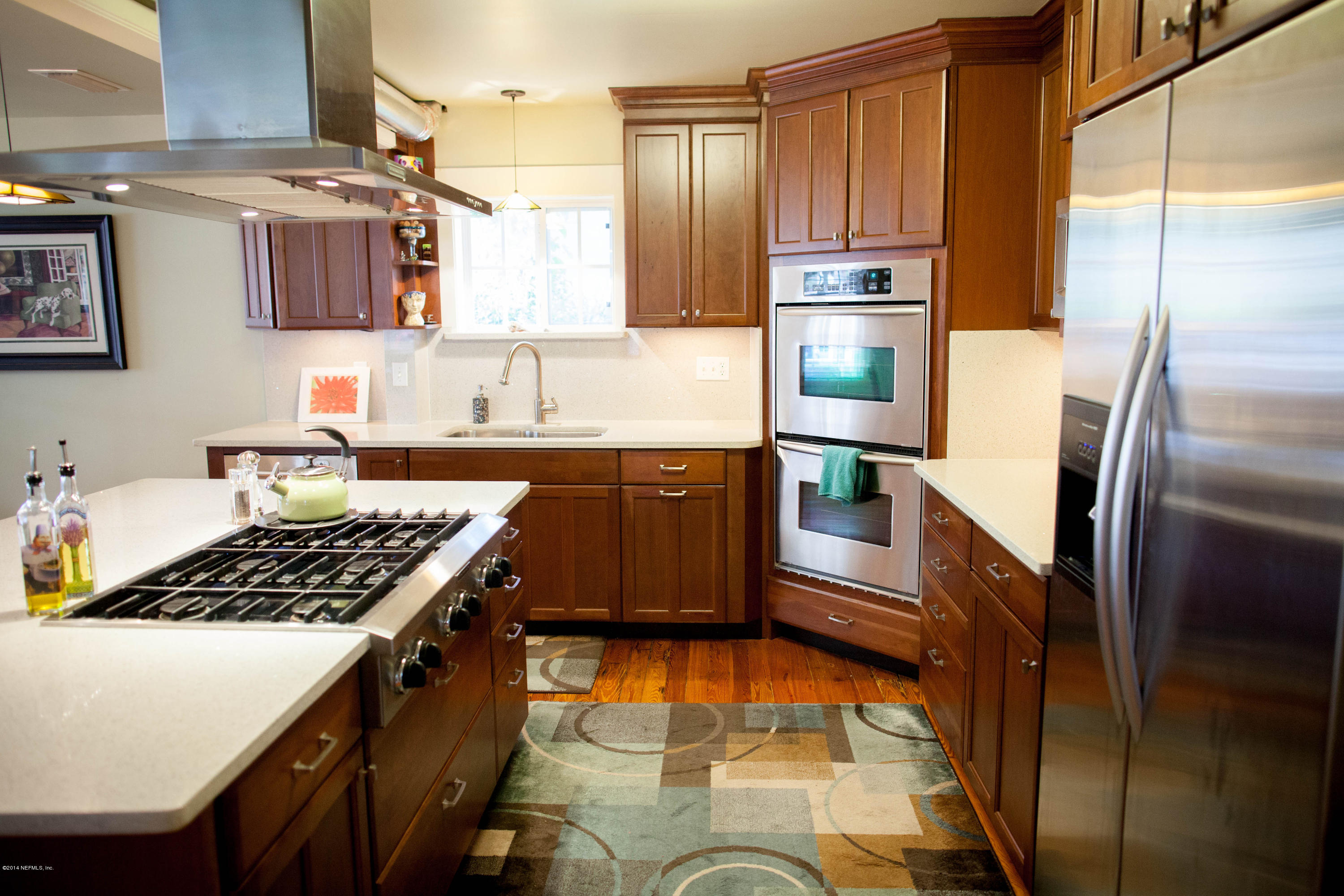 310 7th Street Atlantic Beach, FL 32233 - Photo 8 of 37 a kitchen with stainless steel appliances a stove a refrigerator and a sink