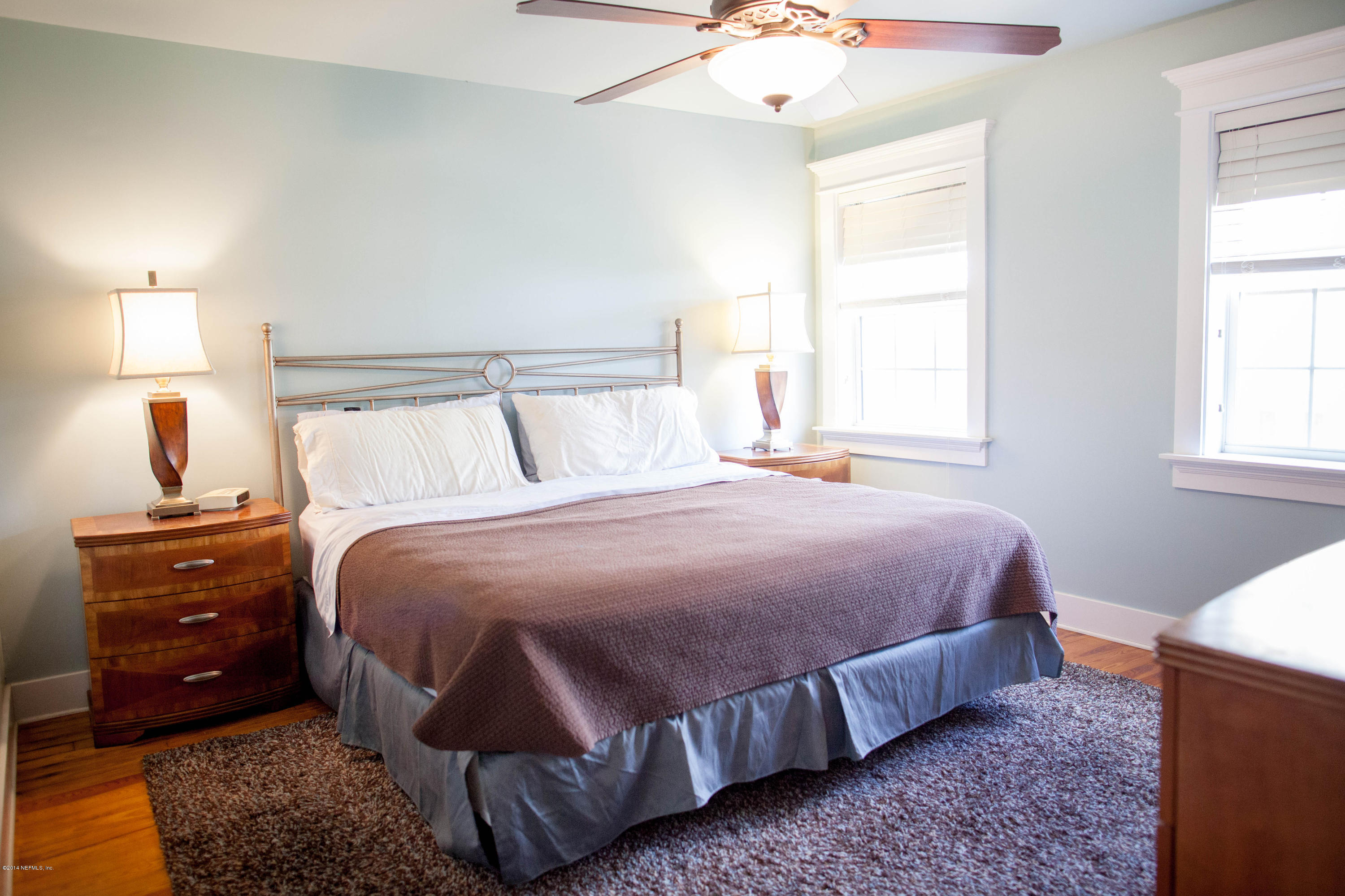 310 7th Street Atlantic Beach, FL 32233 - Photo 10 of 37 a bedroom with a bed and a lamp