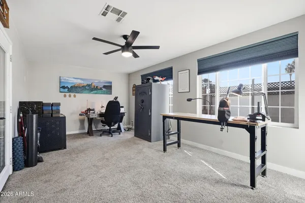 a view of a livingroom with furniture and a window