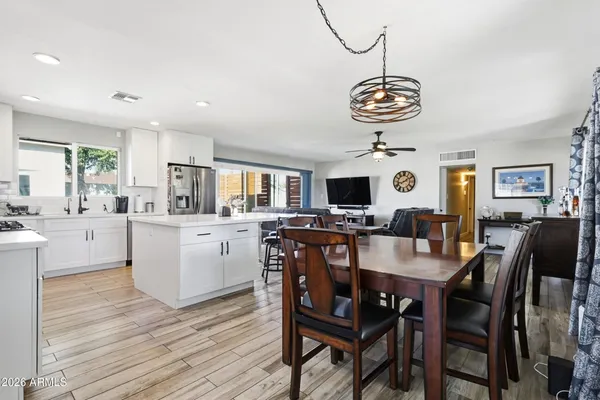 a view of a dining room with furniture window and wooden floor
