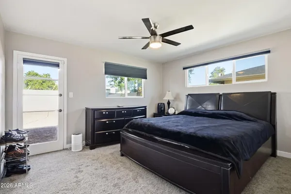 a bedroom with a bed and window