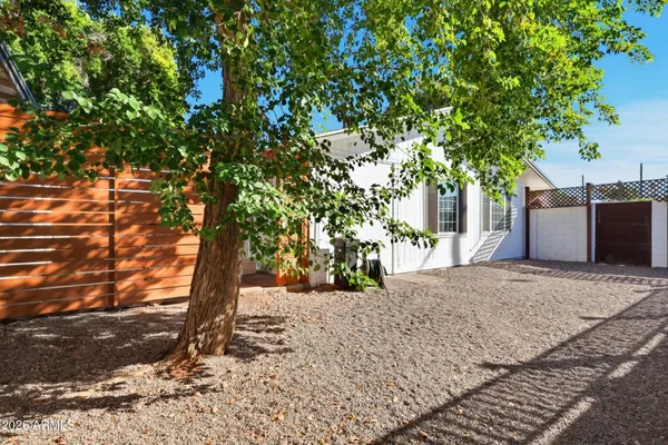 a view of a backyard of the house