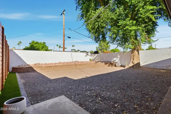 a view of a house with a yard and a garage