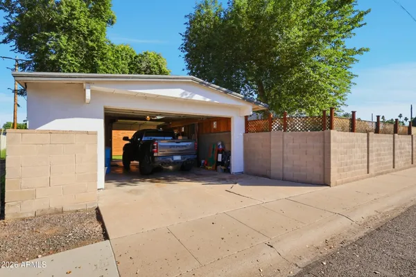 a view of a car park in front of house