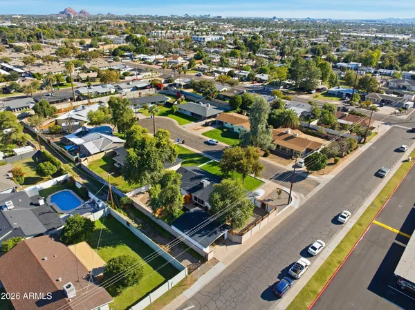 an aerial view of residential houses with outdoor space