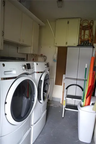 a sign that is sitting in front of flowers