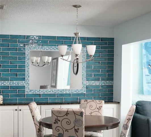 a front view of a house with outdoor seating