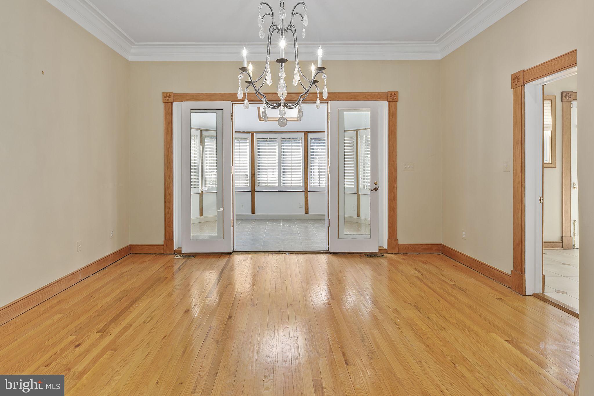 2344 S Street Northwest Washington, DC 20008 - Photo 8 of 52 Dining room opening to sunroom and kitchen (right)