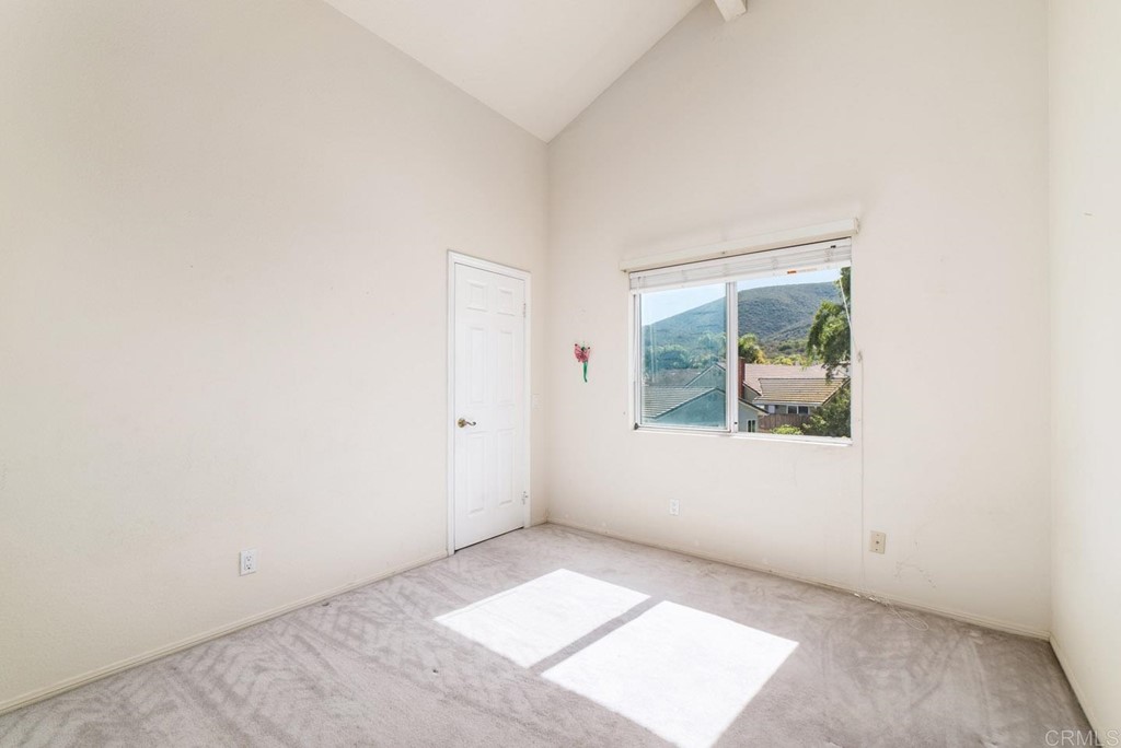 887 Quail Hill Drive San Marcos, CA 92078 - Photo 21 of 22 an empty room with windows