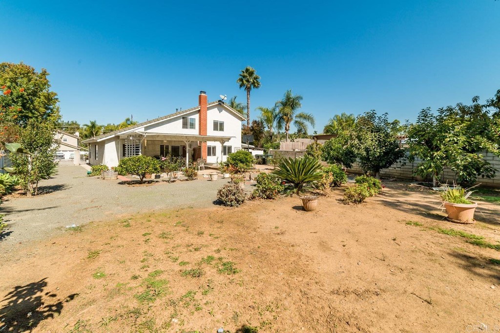 887 Quail Hill Drive San Marcos, CA 92078 - Photo 22 of 22 a view of a road with a building in the background