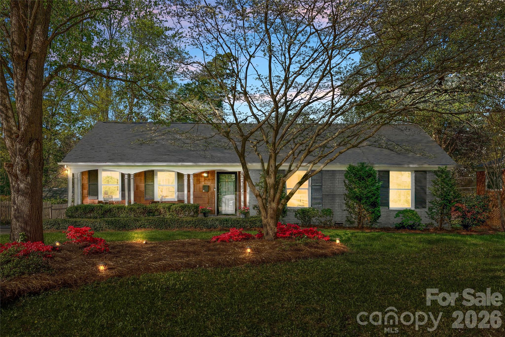 5100 White Oak Road Charlotte, NC 28210 - Photo 1 of 43 a front view of a house with a yard and garage